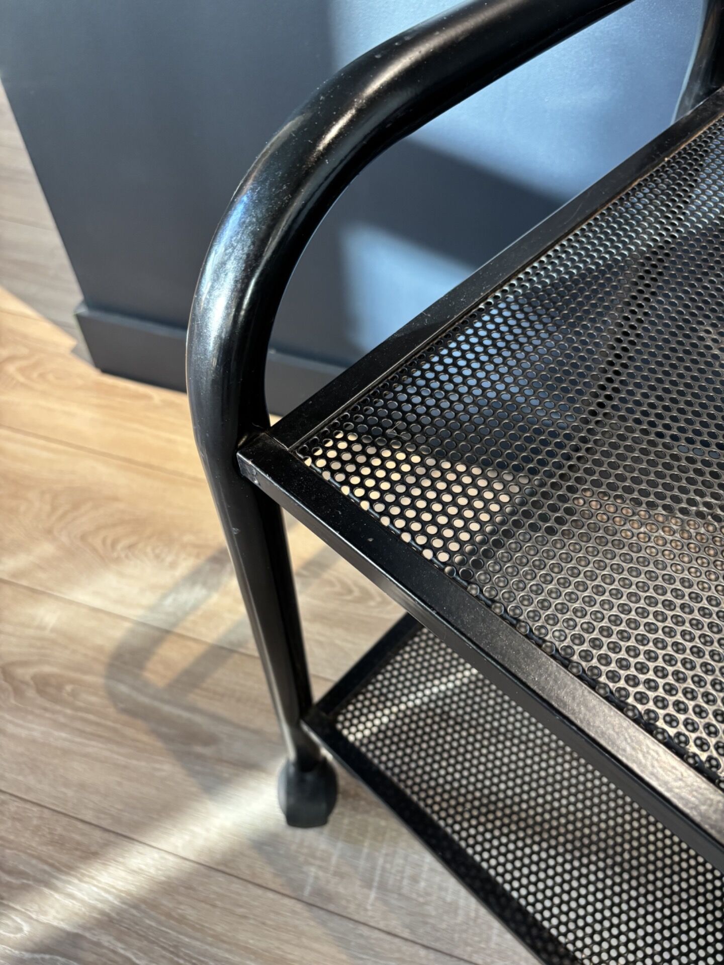 Vintage black metal rolling dessert trolley