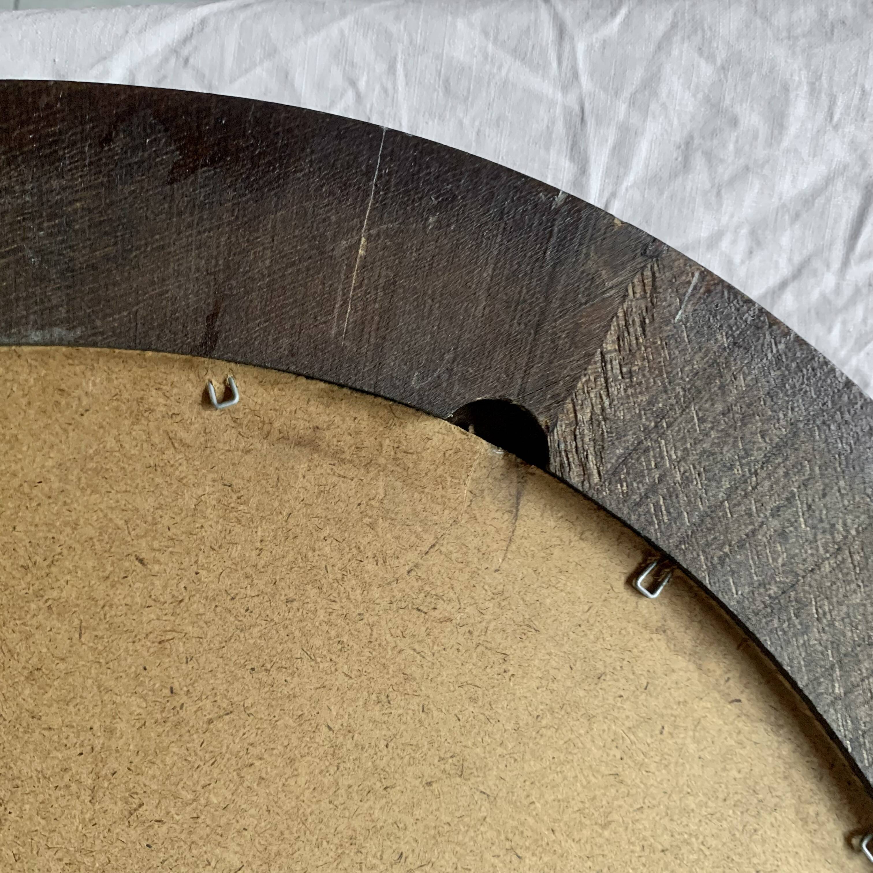 Old large oval wooden wall mirror