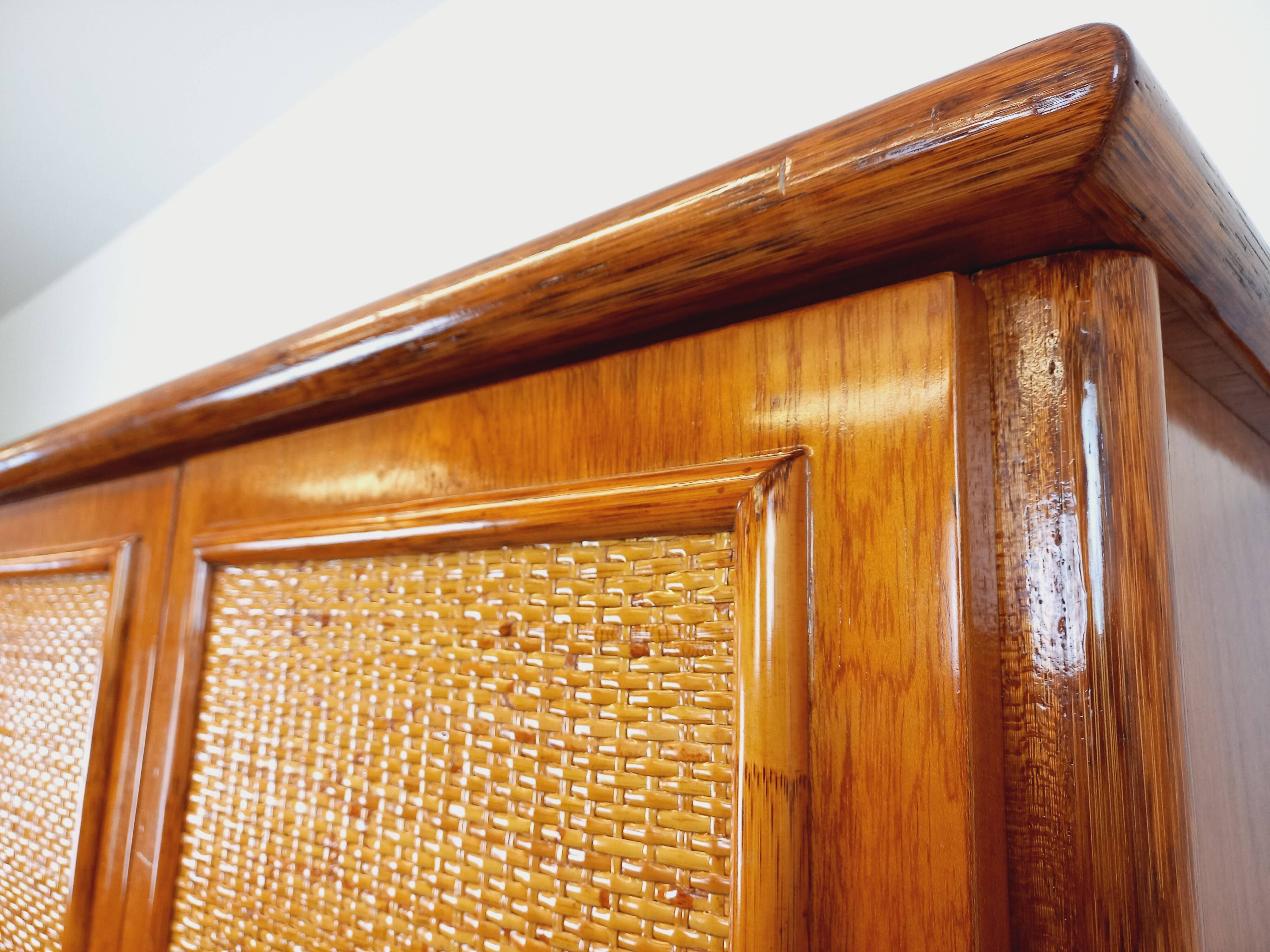 Vintage woven rattan and wood armoire by Maugrion for Roche-Bobois.