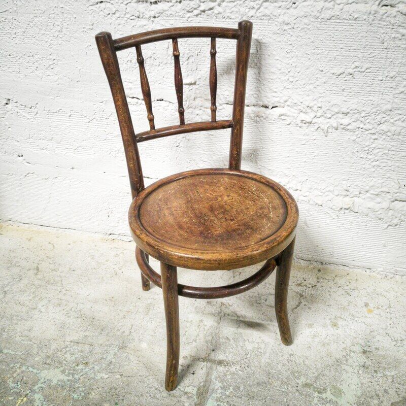 Antique children's chair in curved wood