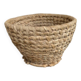 Brown woven wicker basket for collecting eggs — France, 1940s