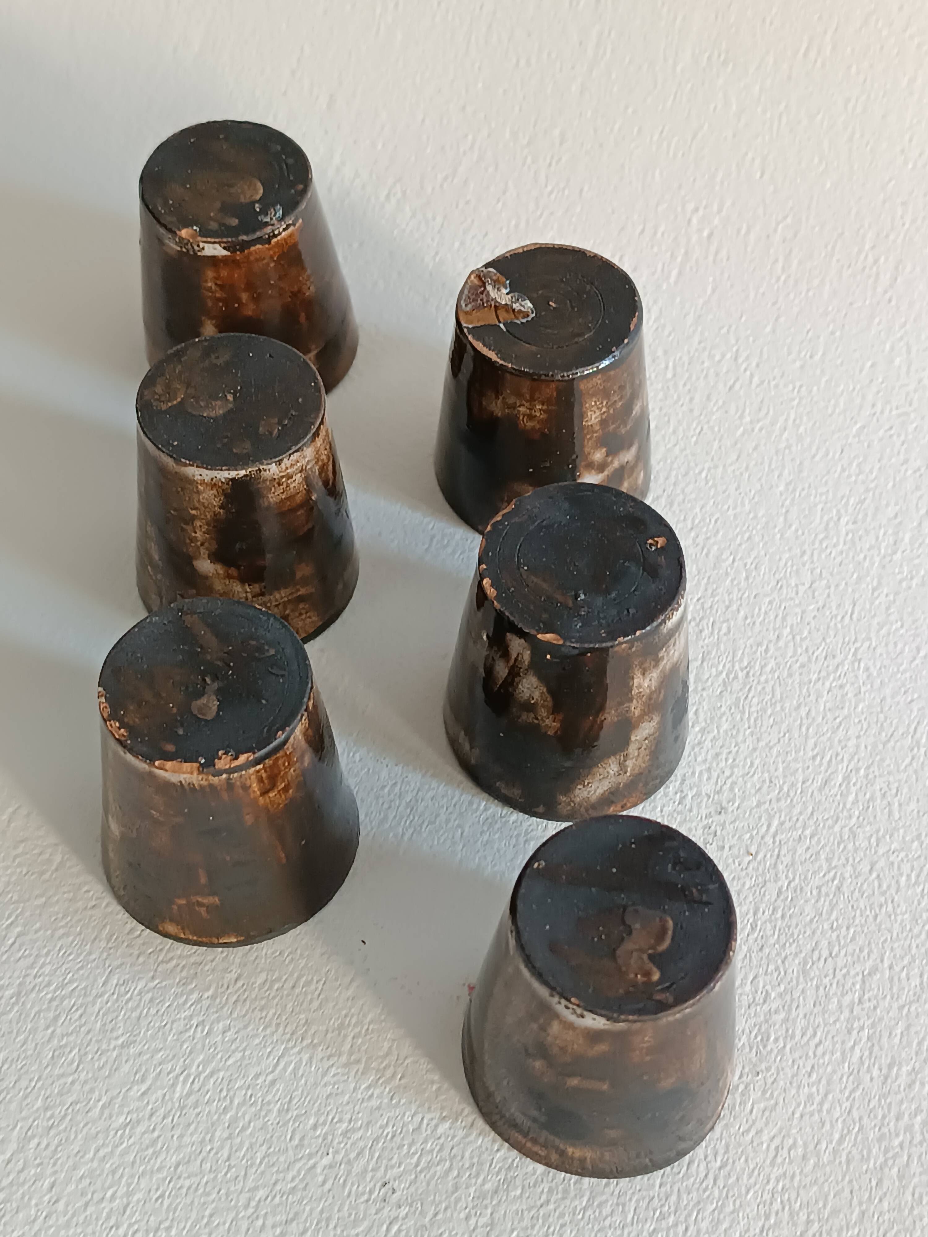 A bottle and six ceramic cups by Gérard Hofmann Vallauris 1950.