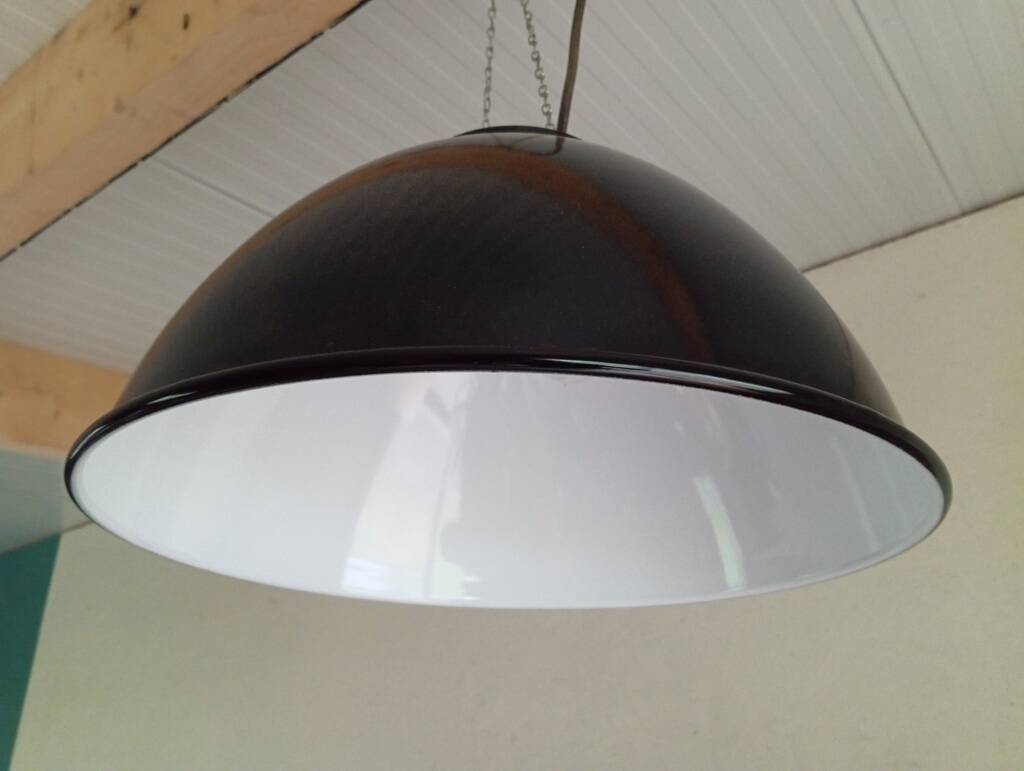 Set of 10 large industrial enamelled metal pendants.