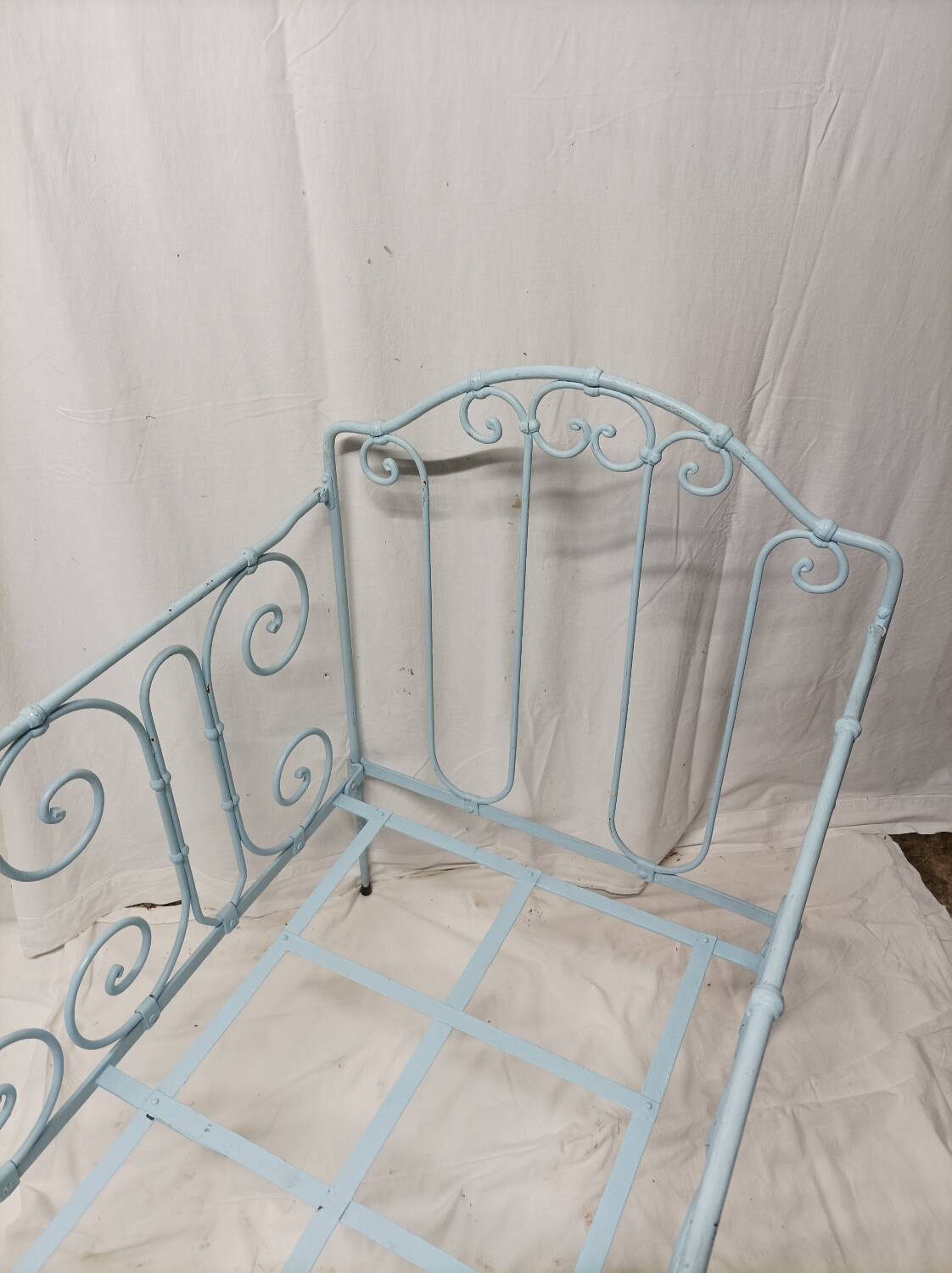 Old children's bed with metal bars