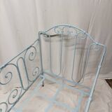 Old children's bed with metal bars