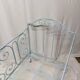 Old children's bed with metal bars