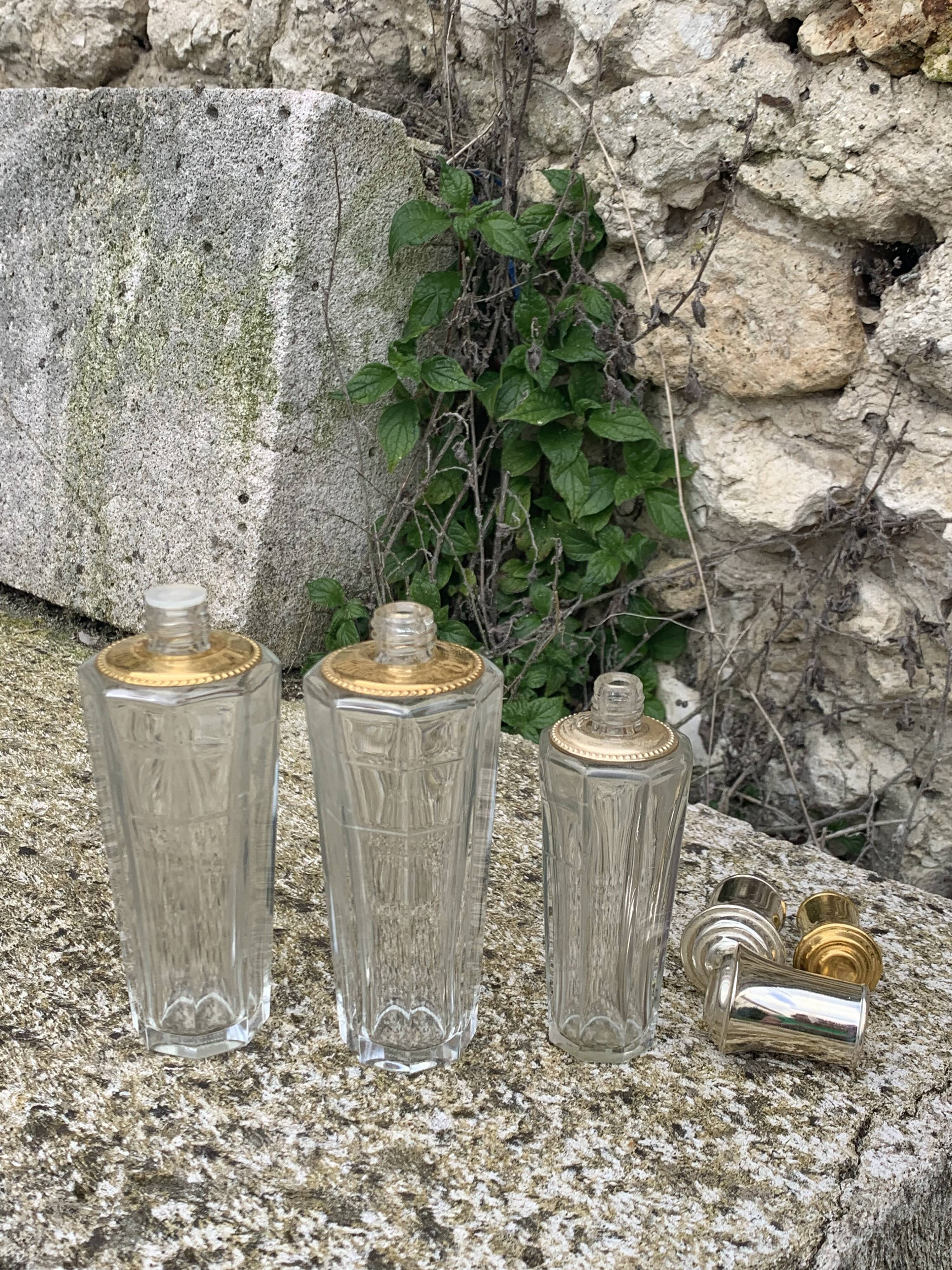 Three bottles of crystal perfume signed Marcel Rochas old france