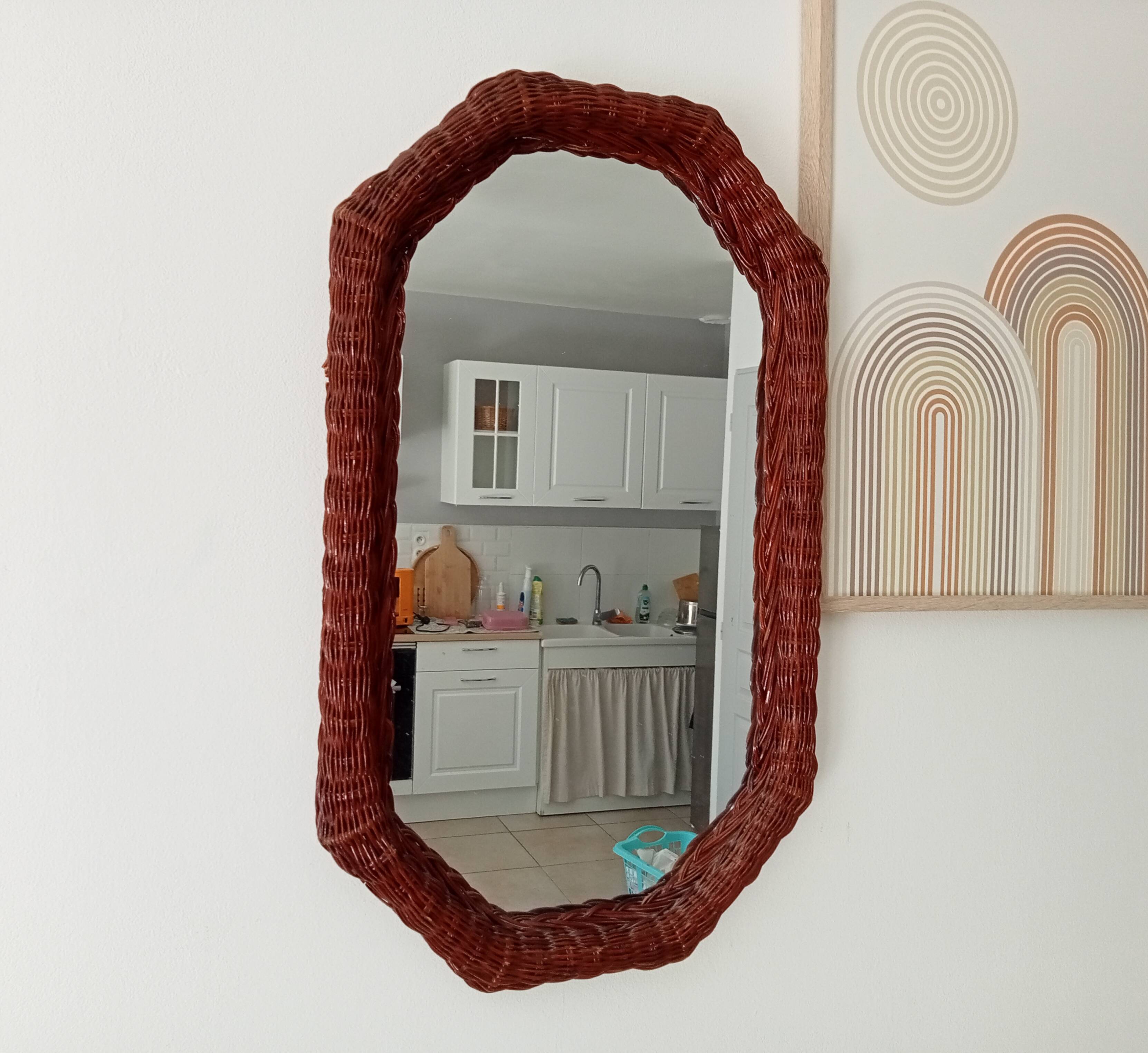 Vintage octagonal mirror in woven rattan.