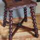Antique stool in turned and carved solid wood