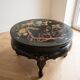 Asian coffee table in Chinese style made of black and gold lacquered wood.