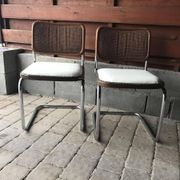Set of 4 Mid-Century brown faux leather chairs with wood and chrome structure (1970s)