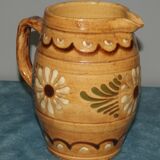 Glazed terracotta pitcher decorated with friezes and flowers