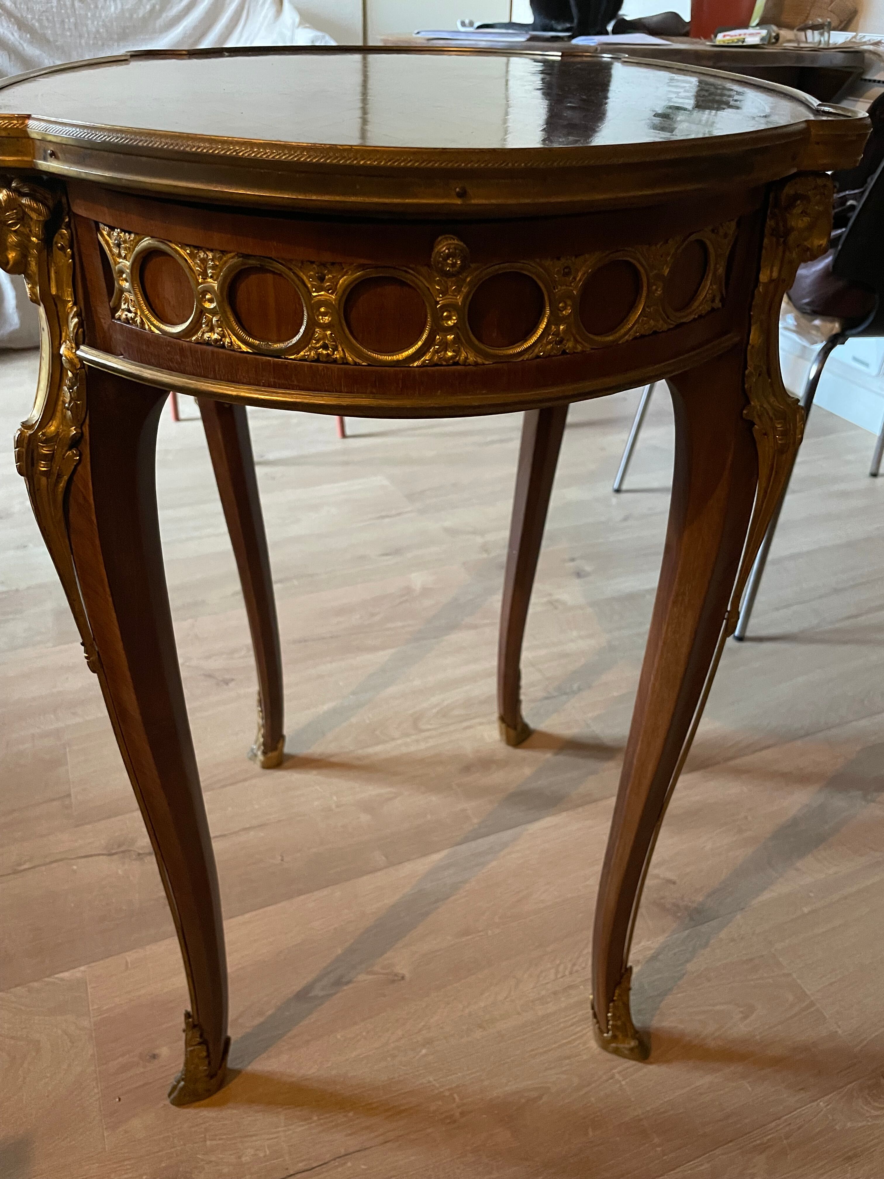 Living room table in Louis XV-Louis XVI transitional style with marquetry and bronze.