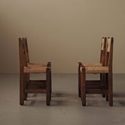 Set of four modernist chairs in oak and straw, France, circa 1960.