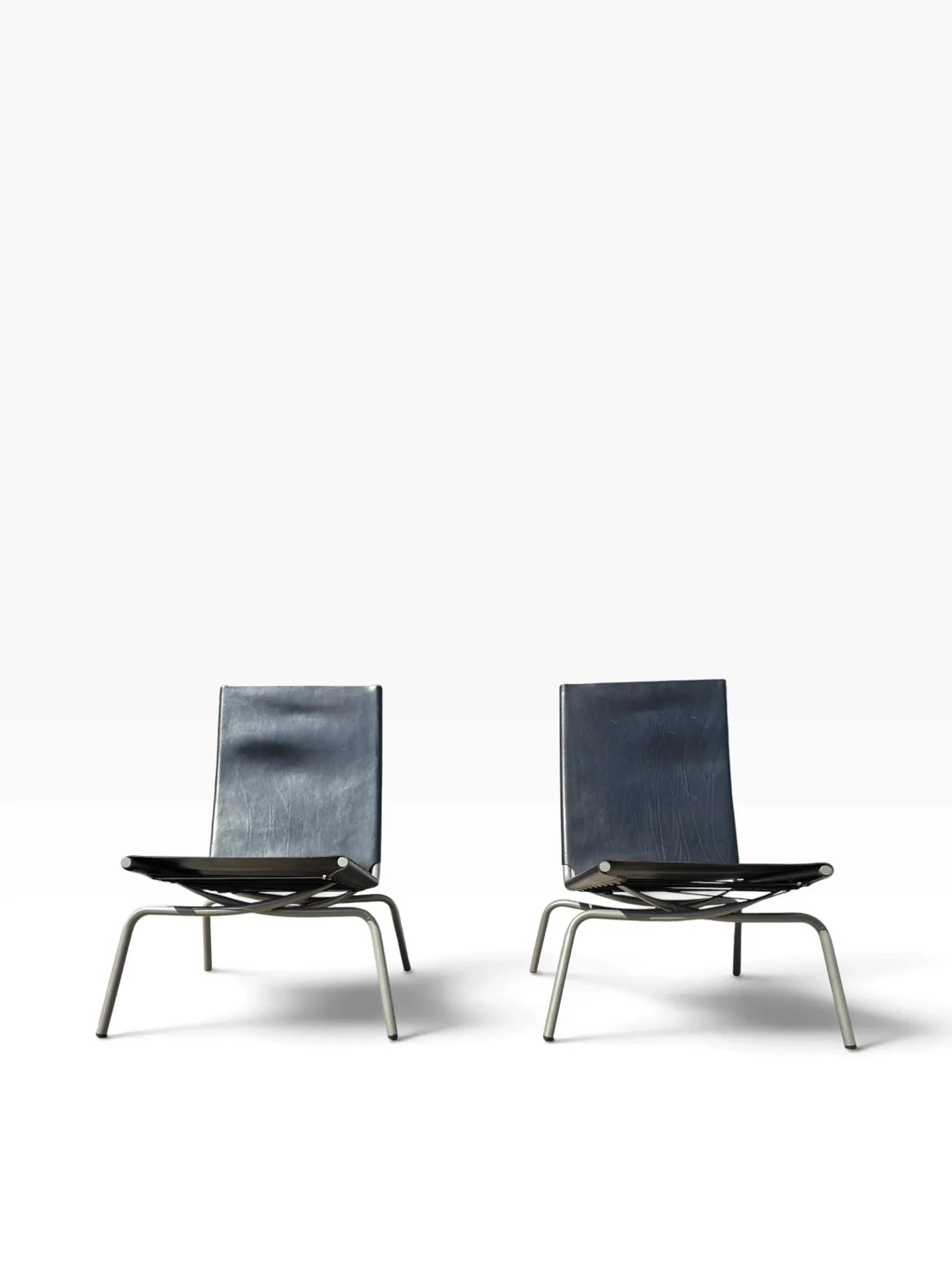 Set of 2 Crossed Legged lounge chairs by Fabiaan van Severen.