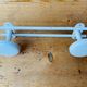 Metal wall coat rack 2 white hooks 60s.