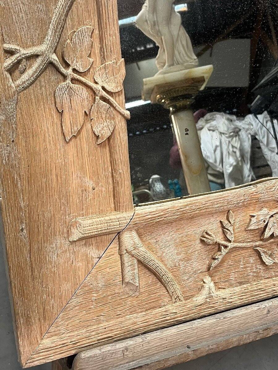 Art Nouveau mirror decorated with poppy leaves, signed by Roger père.