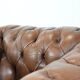 Brown cowhide leather chesterfield armchair  in English style on wheels