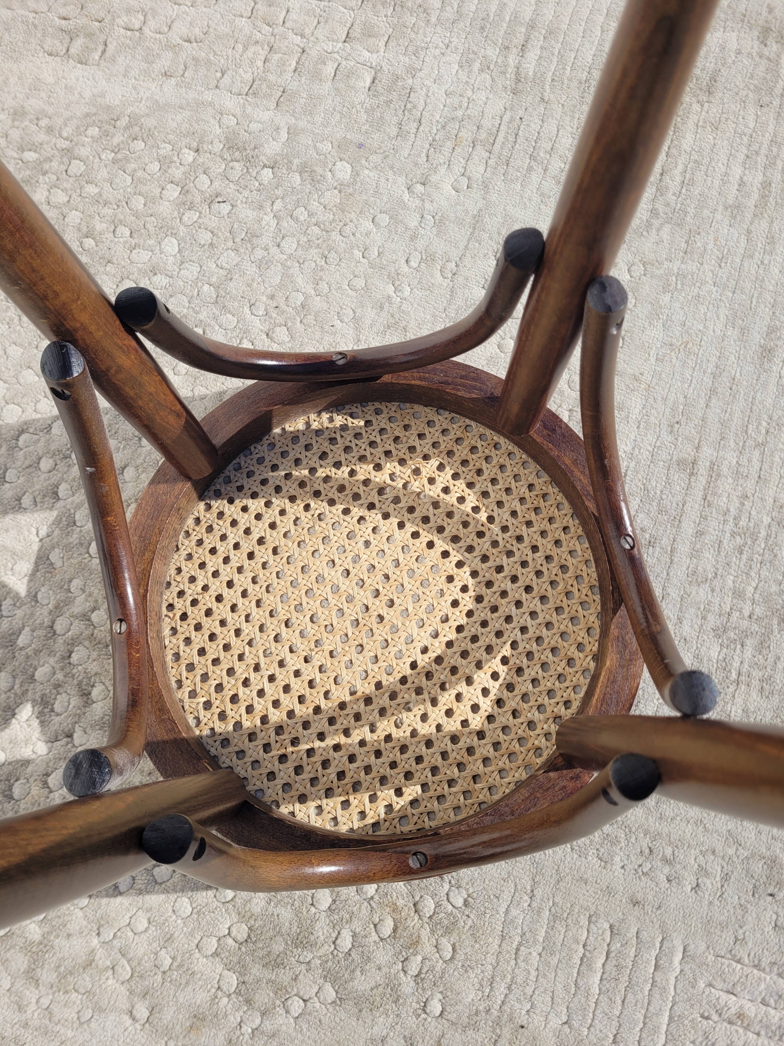 Low stool in cane and curved wood