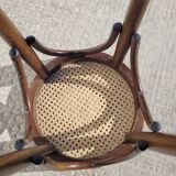 Low stool in cane and curved wood