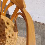 swivel armchair in wood and cane