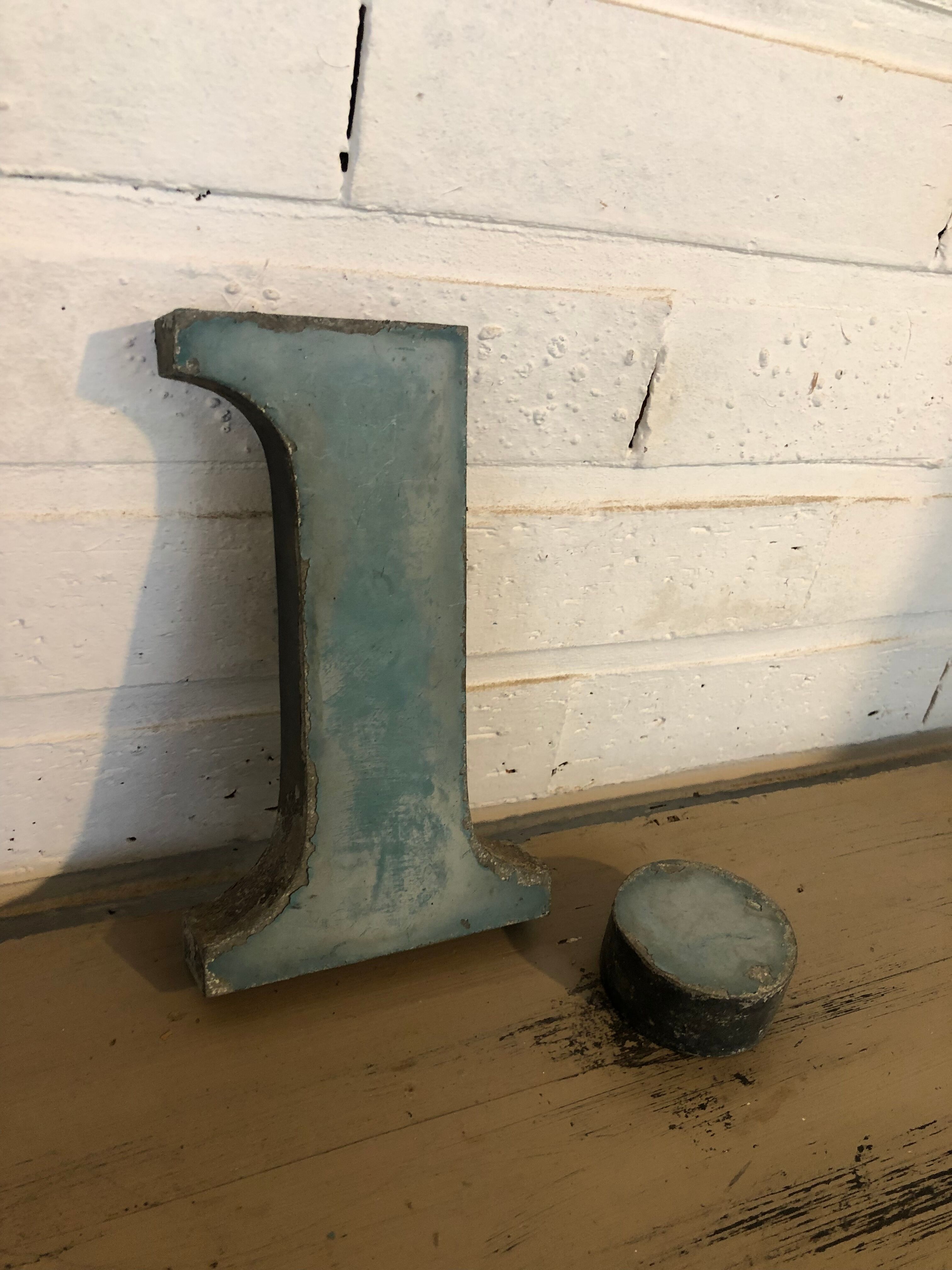 Blue sign letter "i"