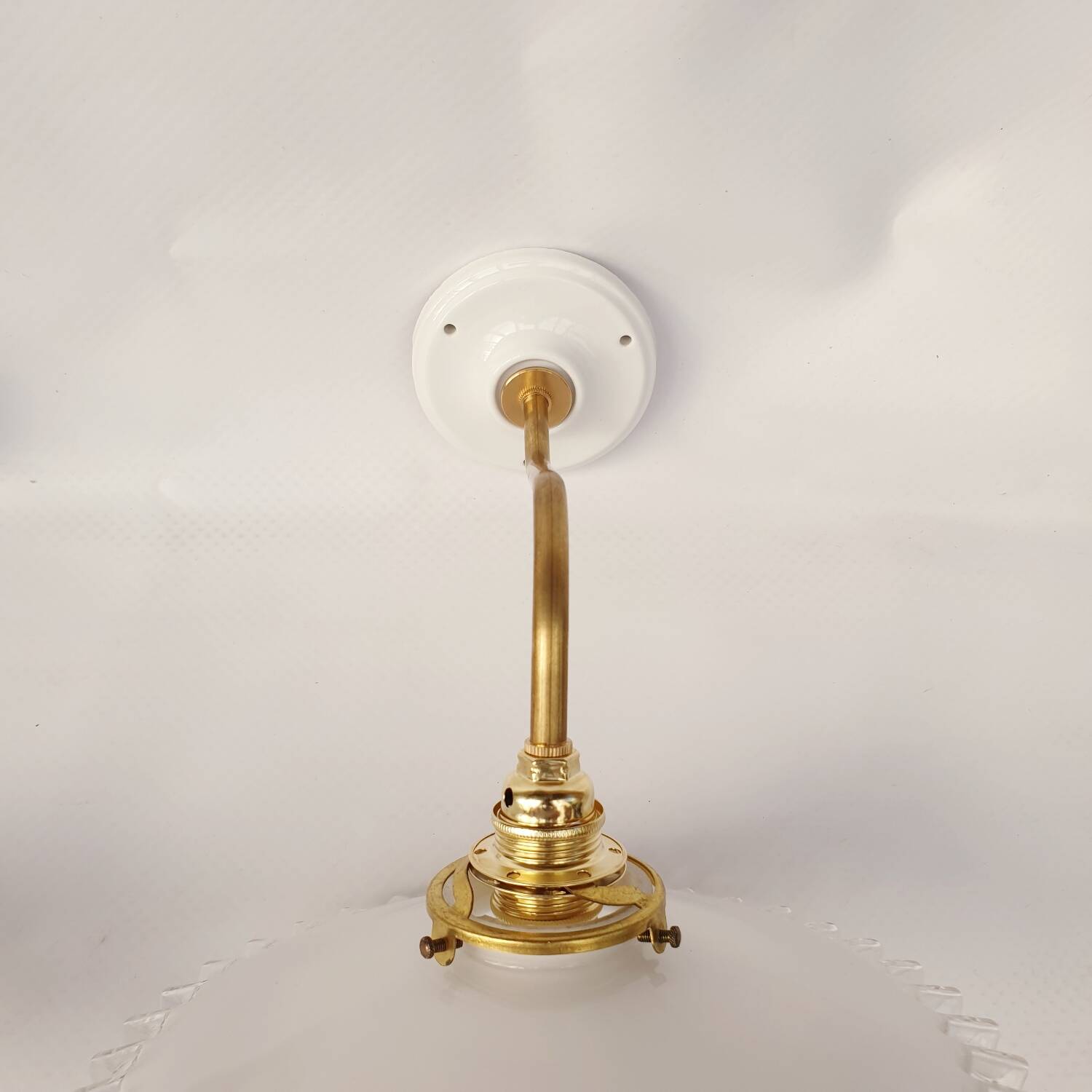 Swan neck sconces in serrated opaline