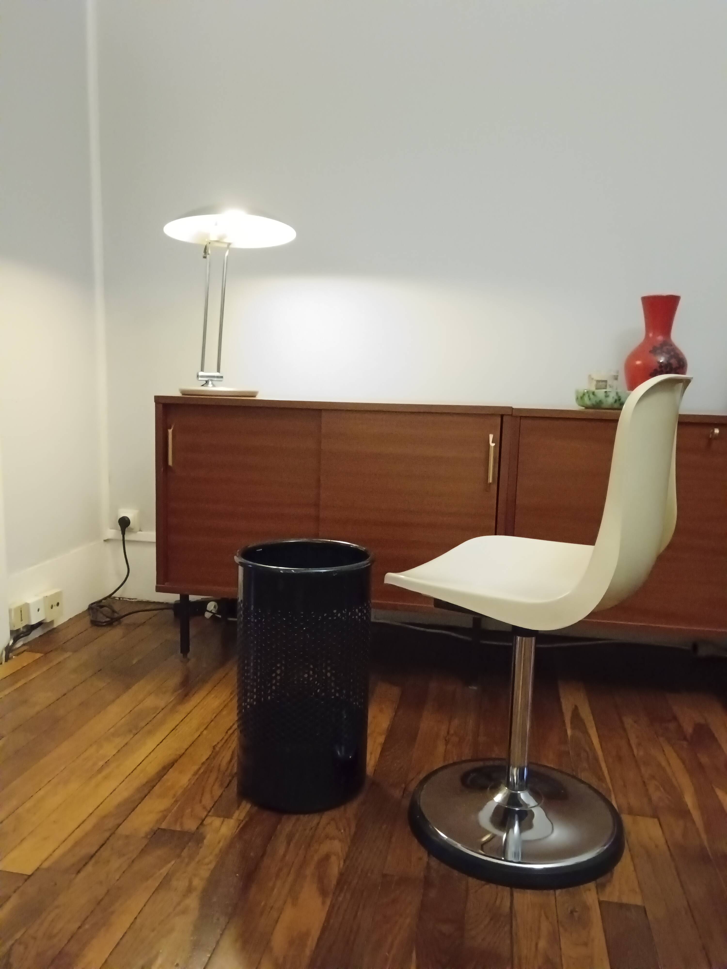 Perforated metal wastebasket