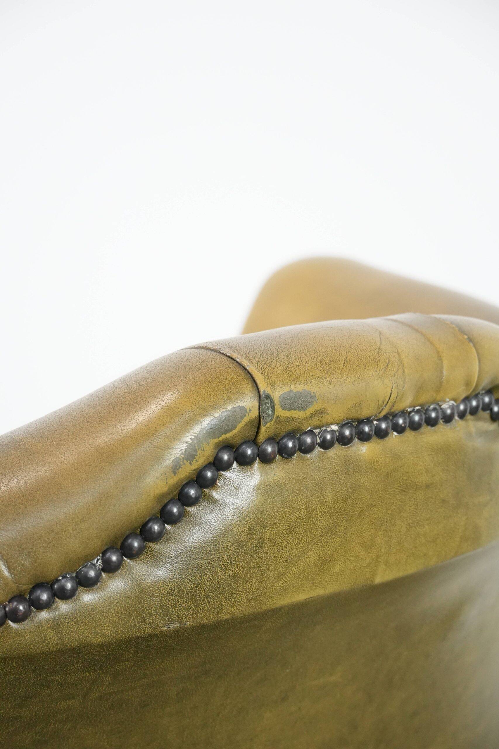 Moss green cow leather Chesterfield wingback armchair in English style