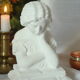 Limestone bust young girl who reads