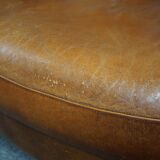 Sheepskin sofa with decorative nails