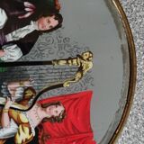 Old round box with decoration fixed under glass