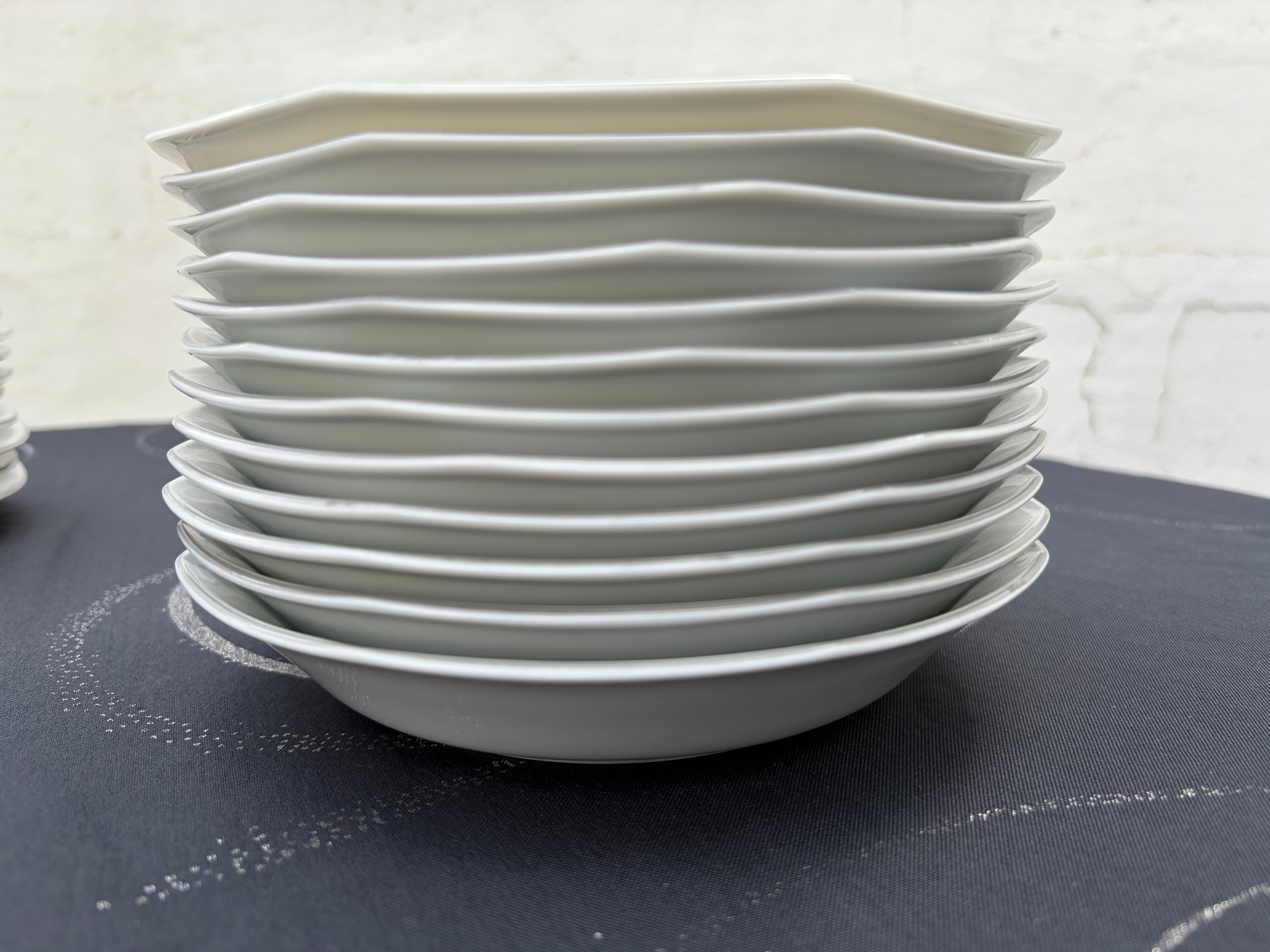 Set of 12 deep porcelain plates from Sologne.