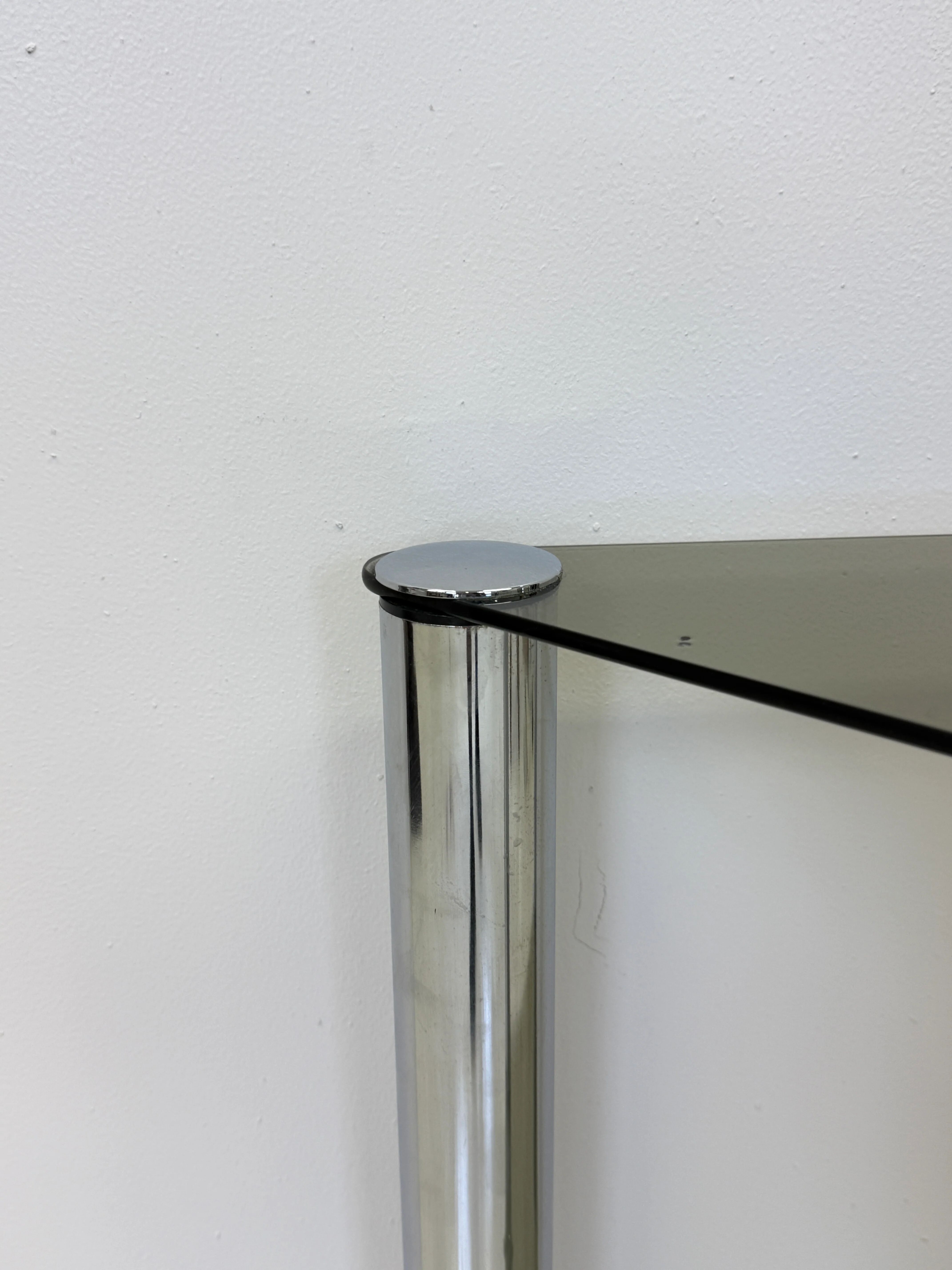 Smoked glass and chrome side table — France, 1970s