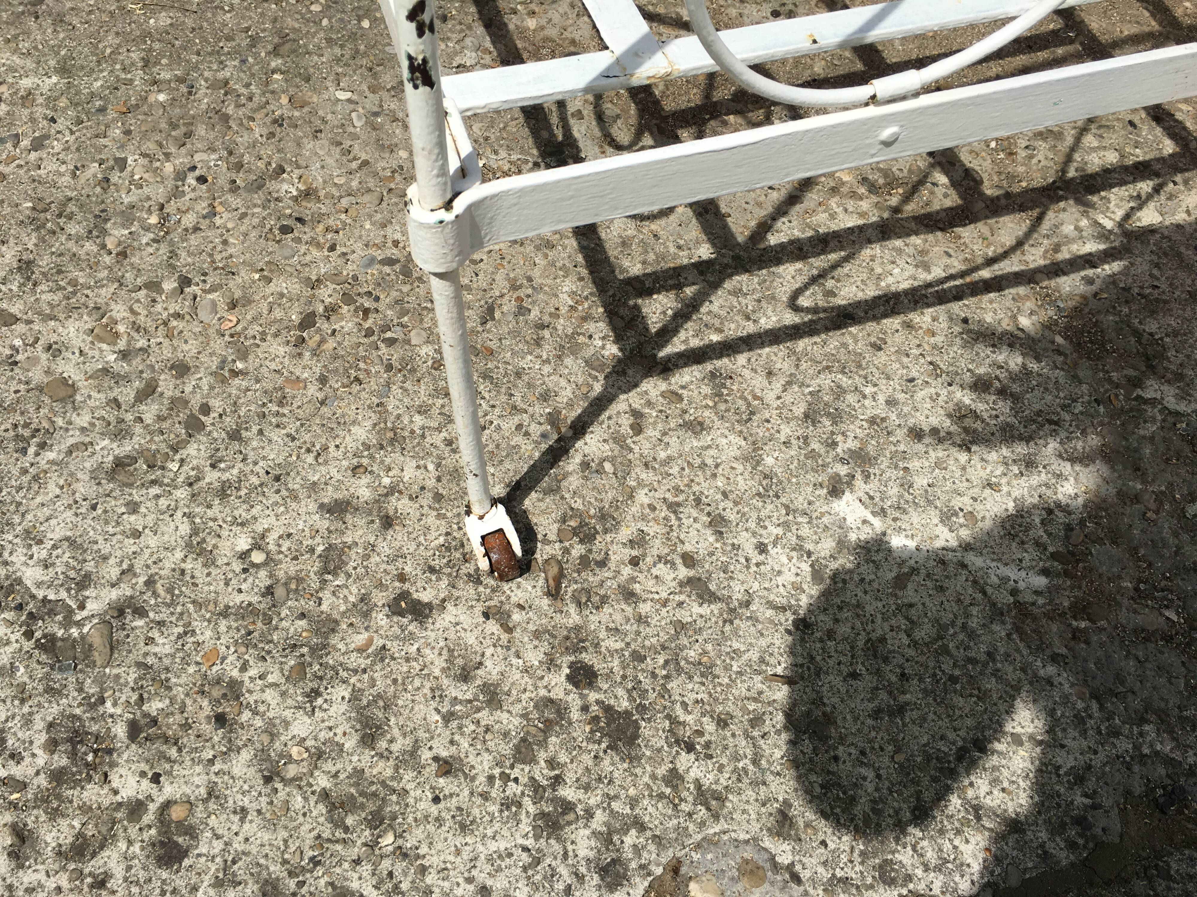 Ancient white metal bed