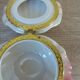 Vintage shell-shaped catchall in iridescent cream and pink ceramic.