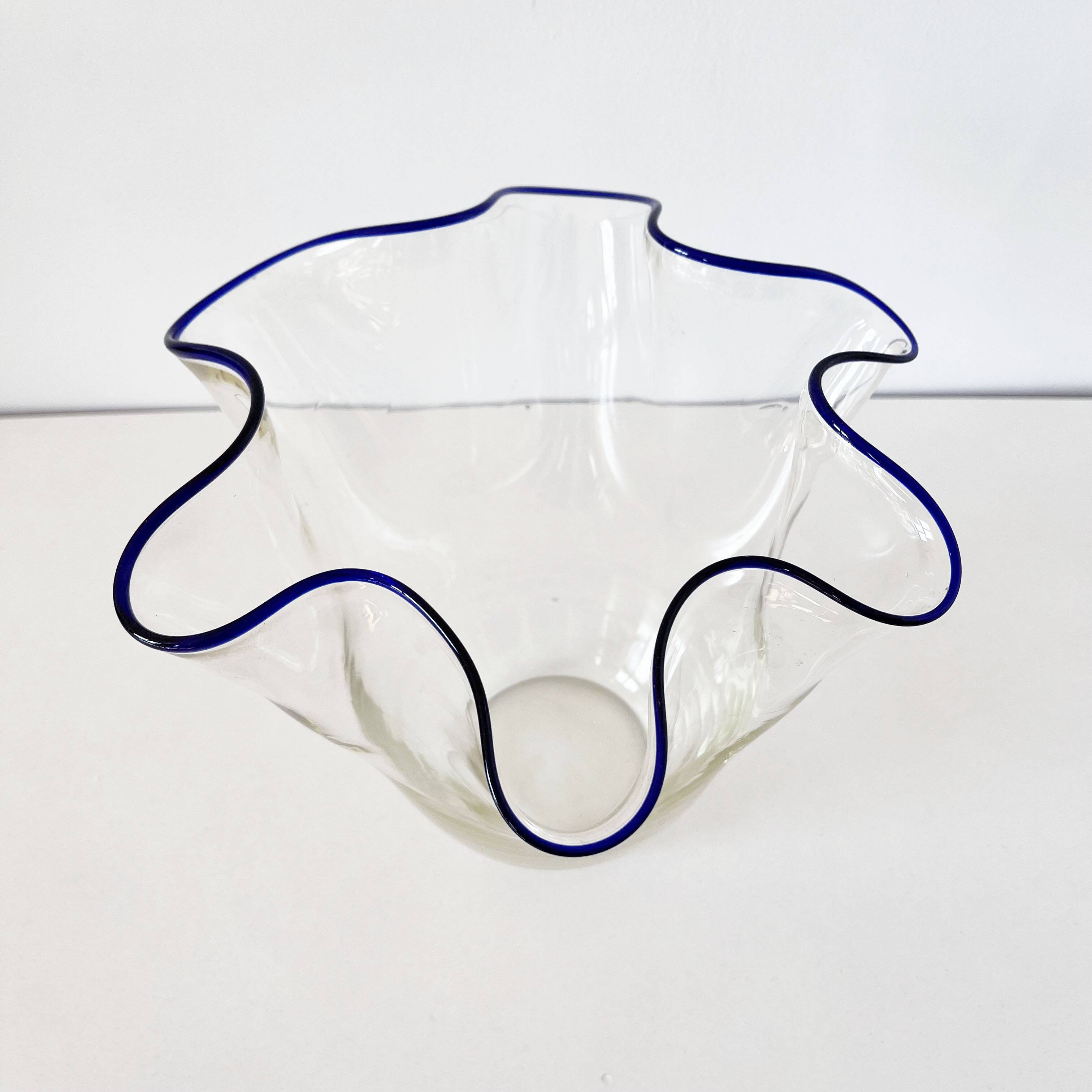 Blue-edged blown glass handkerchief vase