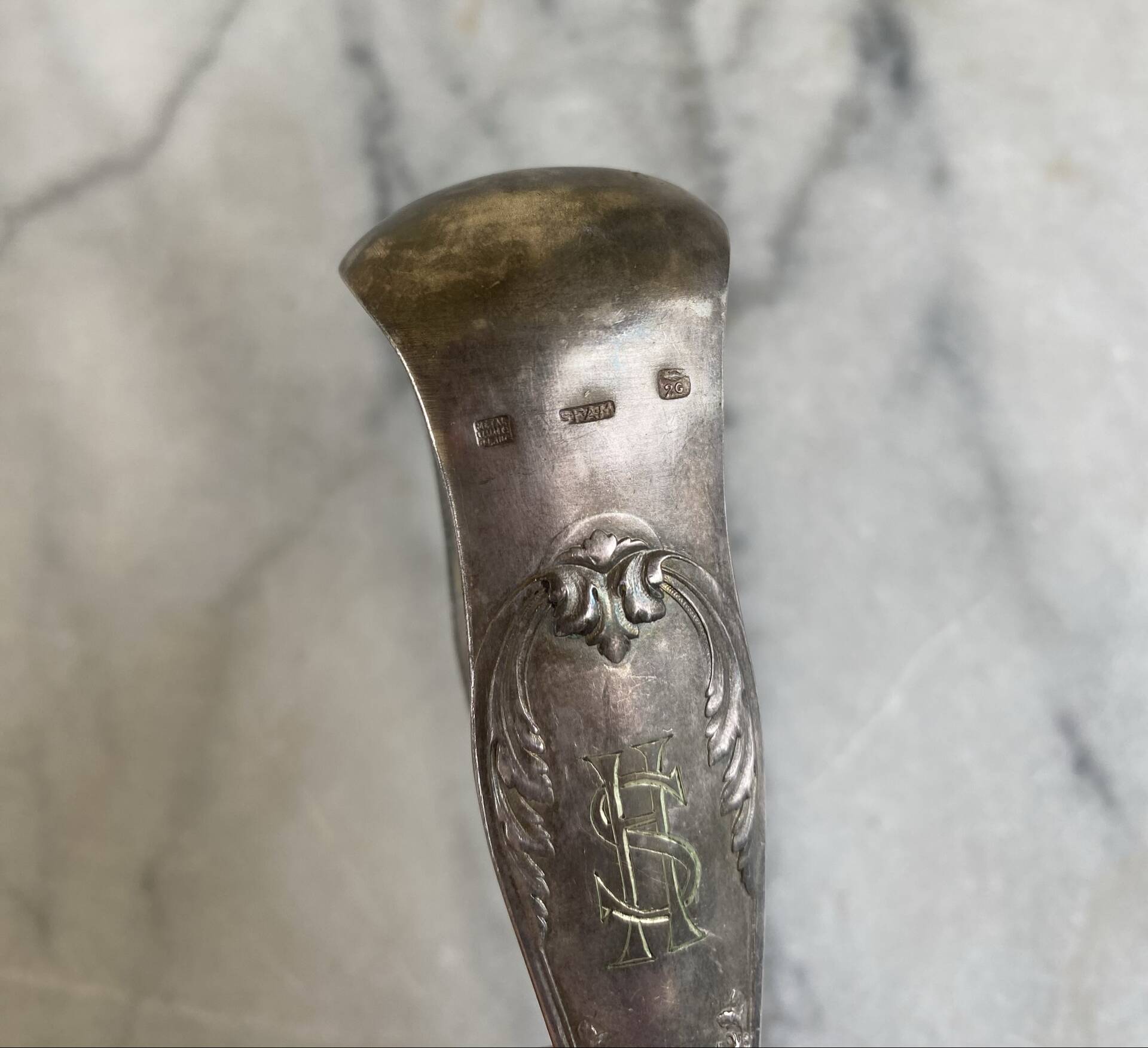 Antique silver-plated sugar tongs SFAM with monogram.