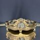 Art Nouveau jardinière in gilded bronze with holly decoration, signed E. Gros.