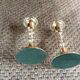 Pair of gold metal candle holders