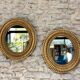 Pair of antique oval mirrors gilded with gold leaf and mercury.
