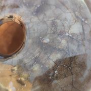 Flattened spherical vase made of glass paste