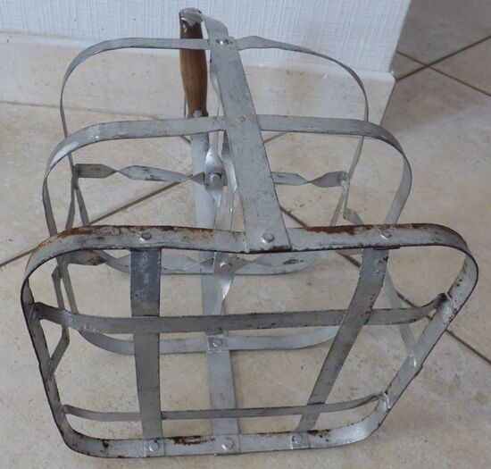 Antique metal bottle holder with wooden handle