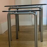 pair of smoked glass nesting tables