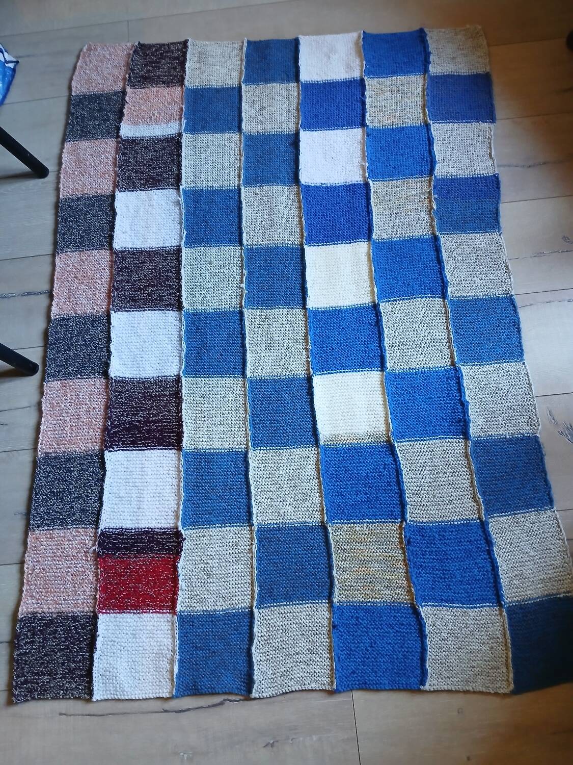 Hand knitted patchwork plaid