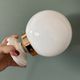Vintage globe wall or ceiling light in white opaline.
