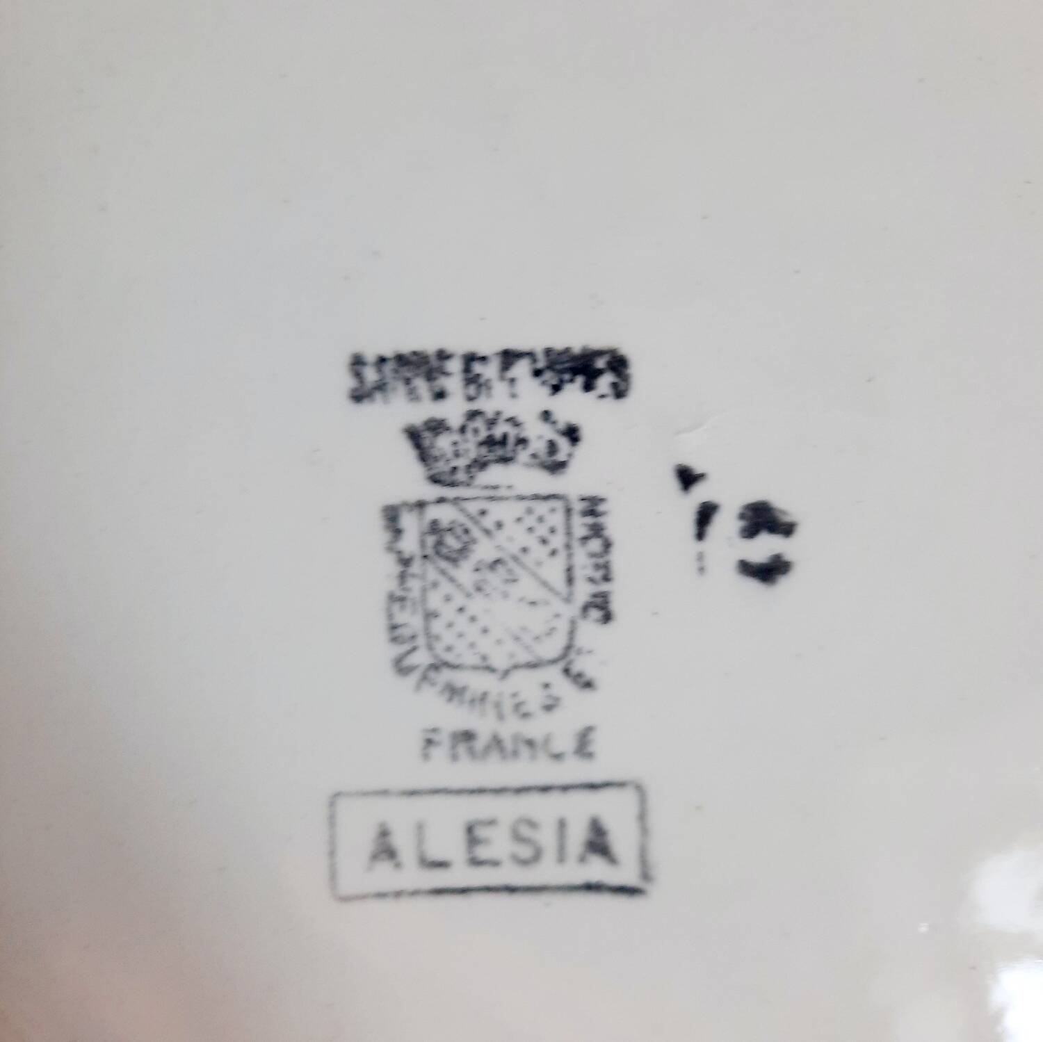 Mismatched antique flat plates in earthenware accompanied by a deep dish.