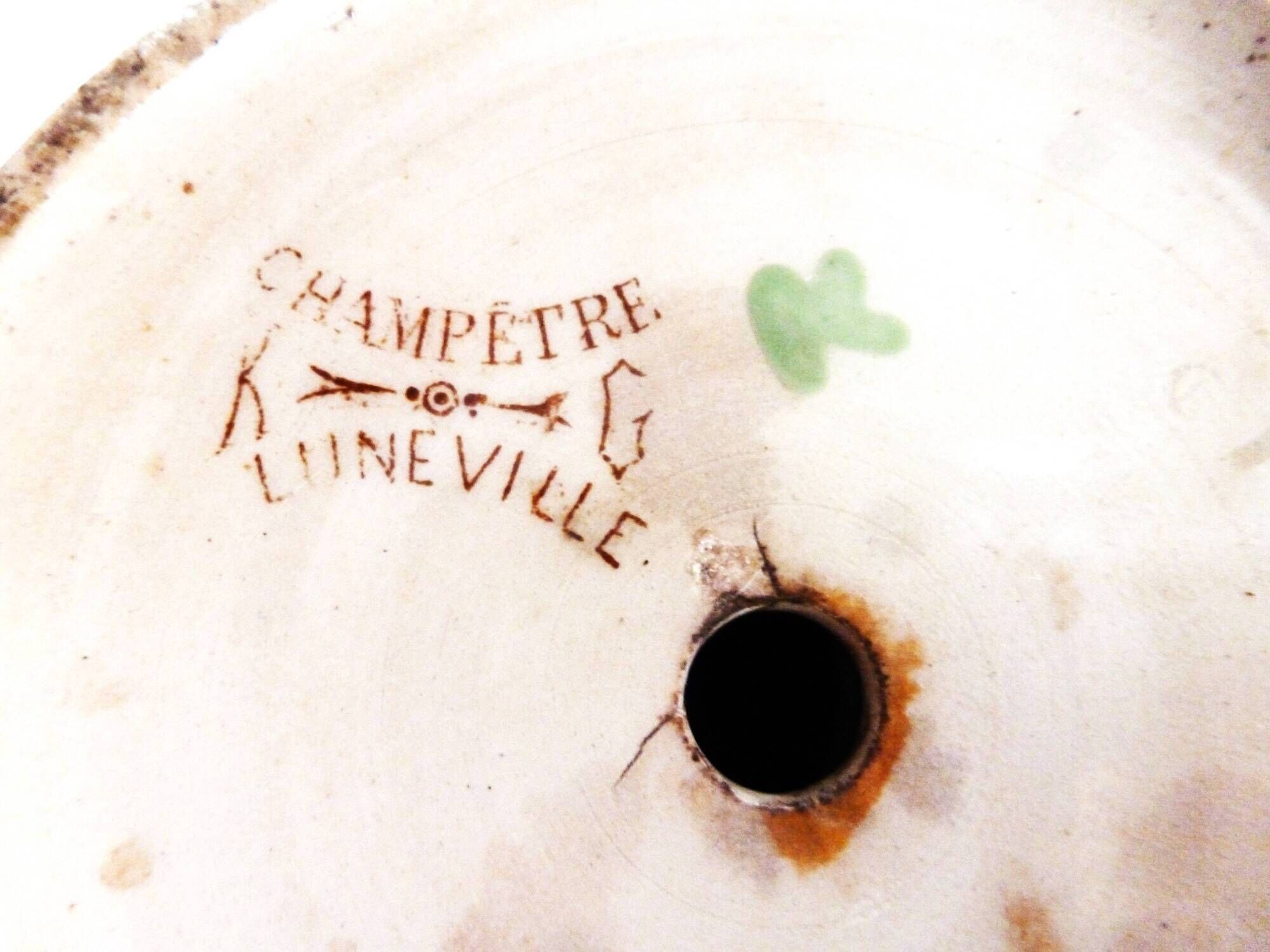 Old ceramic lamp "Lunéville" with a pig bladder shade.