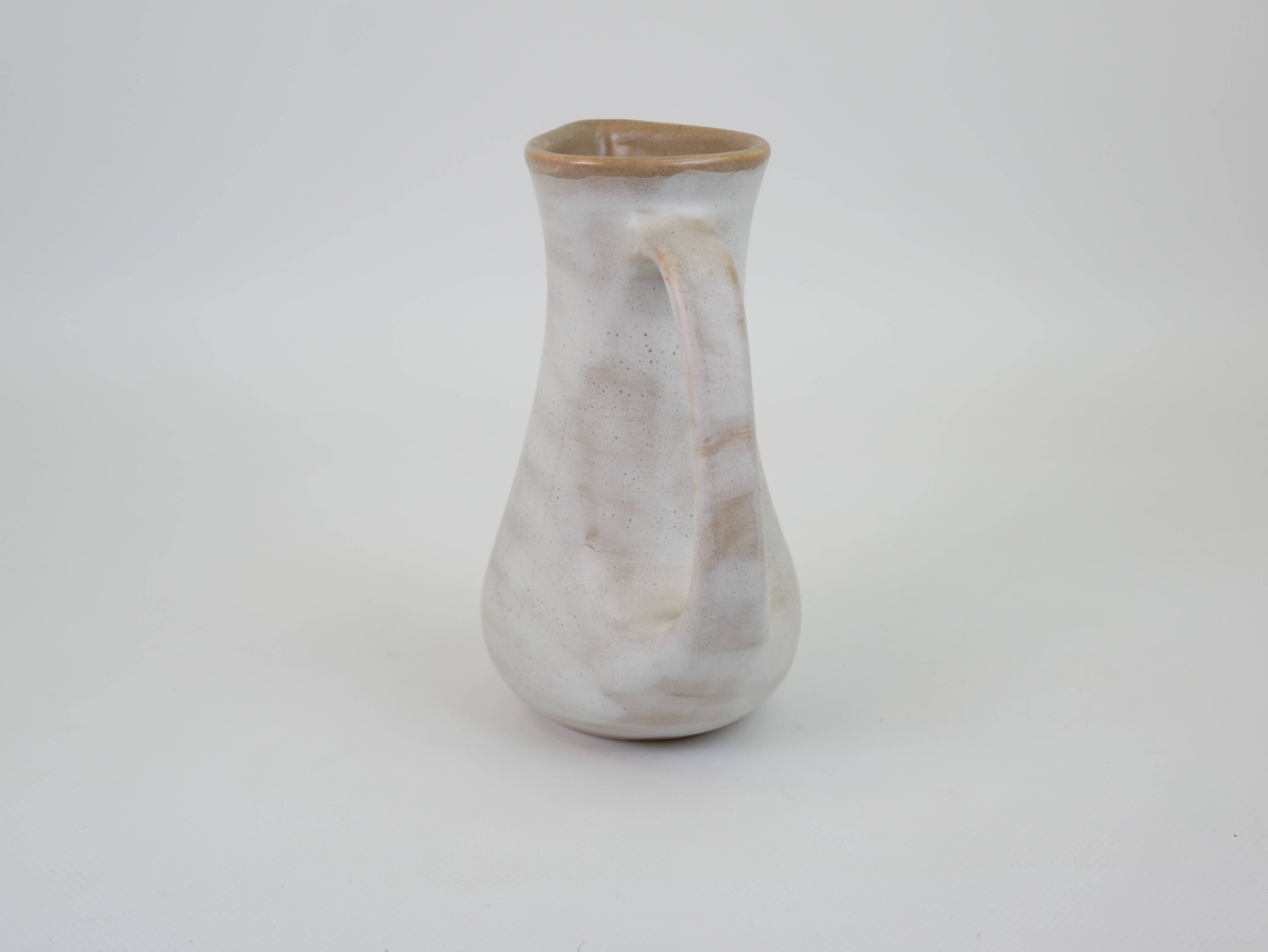 Signed white beige ceramic pitcher