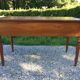 Old farmhouse table louis Philippe style in solid cherry with turned feet.